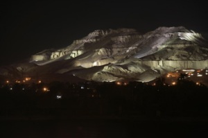 The hill of Gurna on the west bank of Luxor. The illuminated tombs of the nobles can be seen dotting the landscape (Photo: SCA)